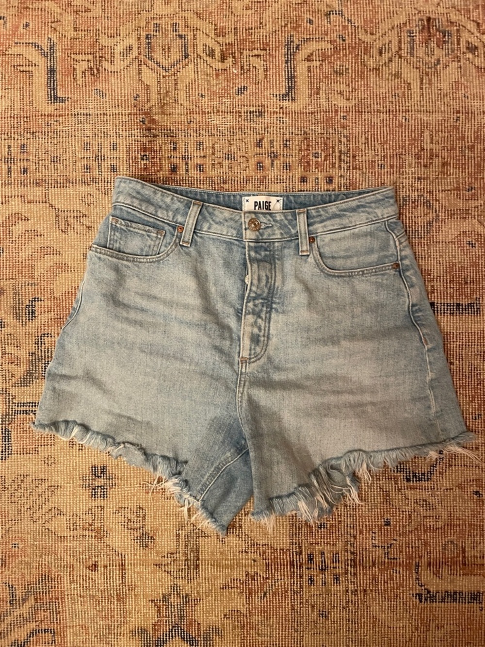 PAIGE Faded Light Blue Denim Cutoff Shorts with Frayed Hem